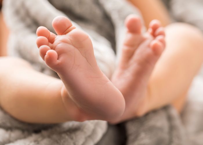 children healthy feet newborn baby close up